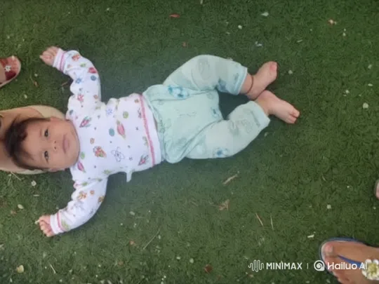 Baby on Grass: Close-Up of Innocence and Nature – AI Generated Video | Hailuo AI