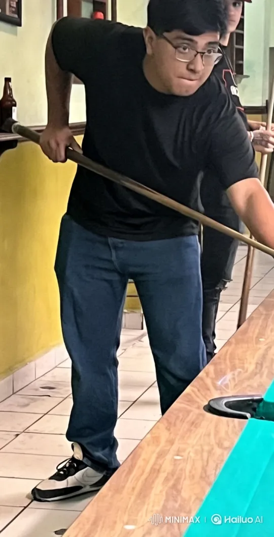 Pool Player Prepares Shot in Casual Setting – AI Generated Video | Hailuo AI