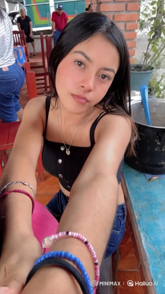 Young Woman Taking Selfie in Vibrant Setting – AI Generated Video | Hailuo AI