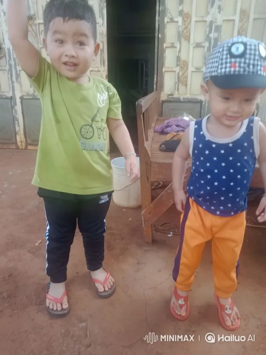 Two Children in Front of Rustic Building – AI Generated Video | Hailuo AI