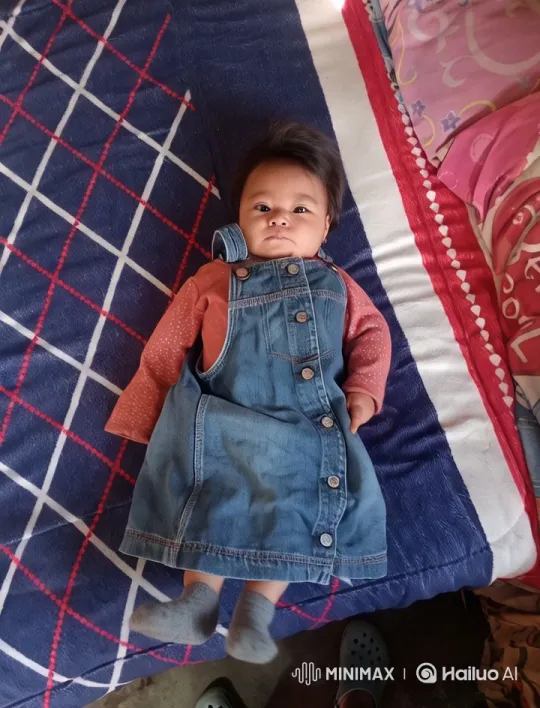 Baby Dancing Joyfully on Colorful Bedspread – AI Generated Video | Hailuo AI