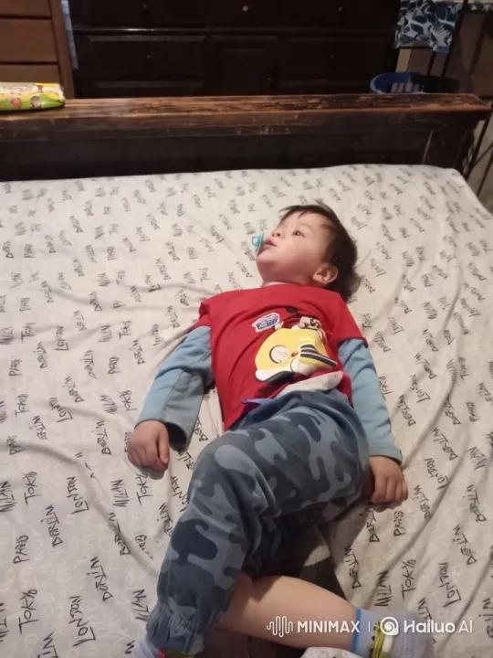 Child Dancing Energetically on Patterned Bed – AI Generated Video | Hailuo AI