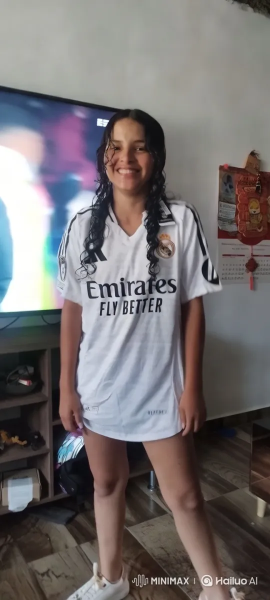 Confident Young Woman in White Real Madrid Jersey – AI Generated Video | Hailuo AI