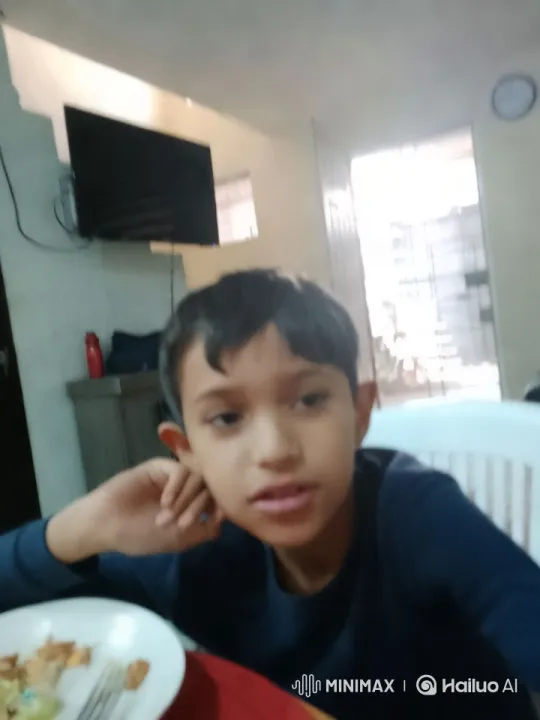 Child Sings at Dining Table with Intimate Camera Work – AI Generated Video | Hailuo AI