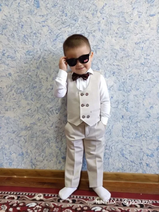 Boy Poses Stylishly Against Textured Blue Wall – AI Generated Video | Hailuo AI