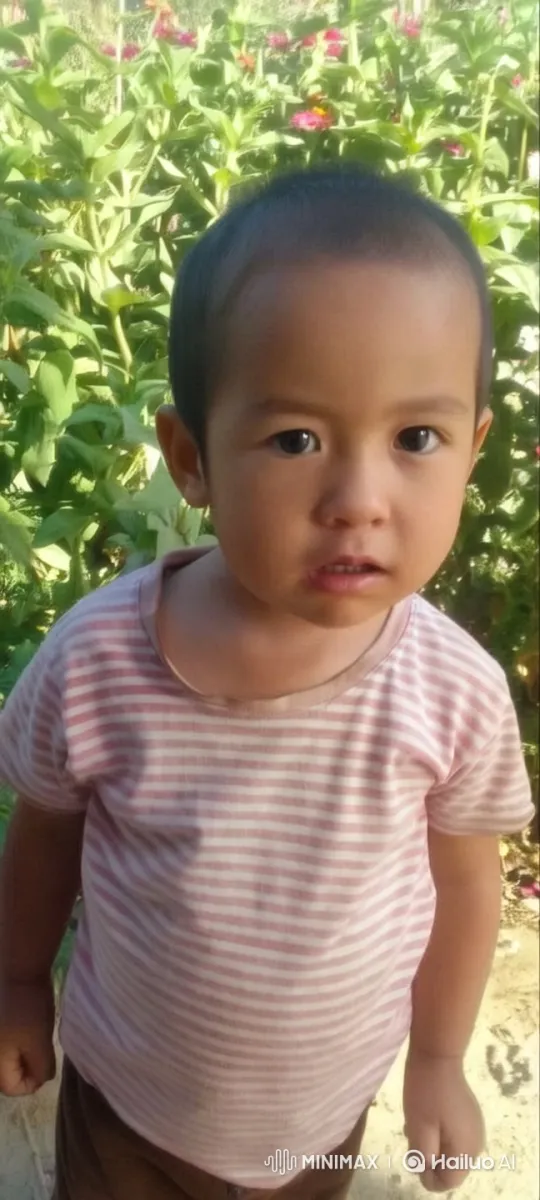 Innocent Child in Vibrant Garden – AI Generated Video | Hailuo AI