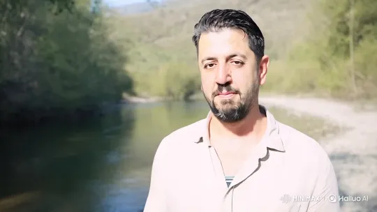 Contemplative Man in Serene Natural Setting – AI Generated Video | Hailuo AI