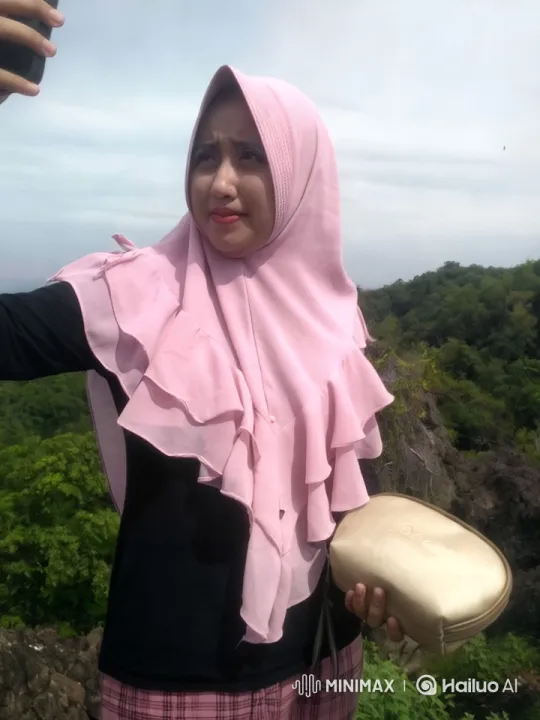 Woman in Hijab Takes Selfie in Scenic Landscape – AI Generated Video | Hailuo AI