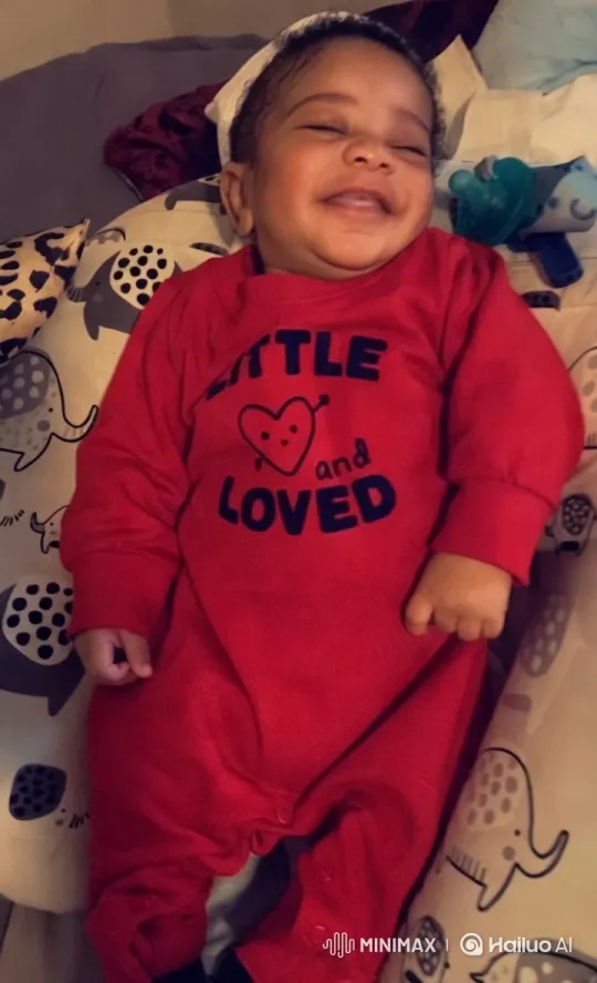 Cozy Warmth: Baby in 'Little and Loved' Onesie – AI Generated Video | Hailuo AI