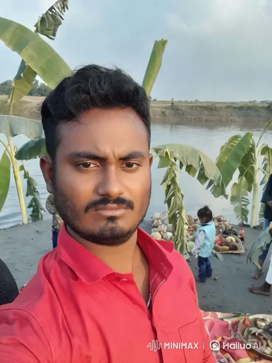 Vibrant Red Shirt Man by Serene River with Cultural Ritual Preparation – AI Generated Video | Hailuo AI