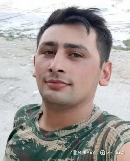 Young Man in Camouflage Shirt: Outdoor Portrait – AI Generated Video | Hailuo AI