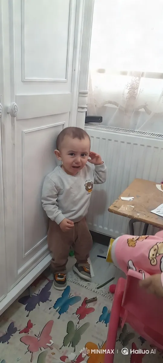 Child by White Wardrobe in Colorful Room – AI Generated Video | Hailuo AI