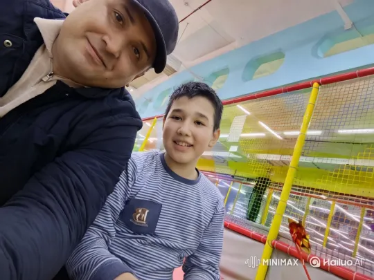 Vibrant Indoor Playground Scene with Joyful Man and Boy – AI Generated Video | Hailuo AI