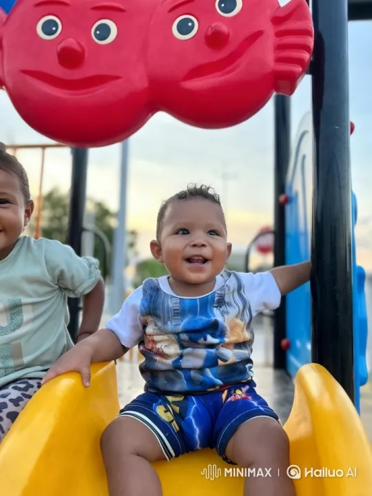 Joyful Toddler's Playful Dance on Playground Slide – AI Generated Video | Hailuo AI