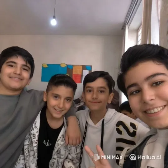Boys Display Friendship and Joy in Bright Classroom – AI Generated Video | Hailuo AI