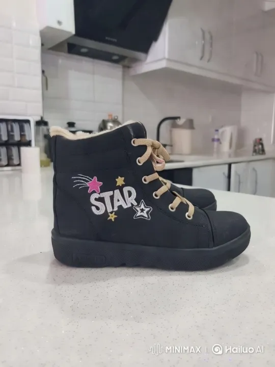 Stylish Boot Showcased in Modern Kitchen Setting – AI Generated Video | Hailuo AI