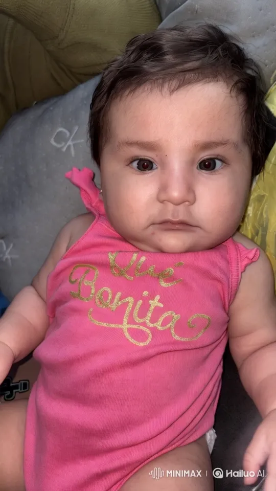 Baby's Joyful Dance in Pink Onesie Captured with Aesthetic Flair – AI Generated Video | Hailuo AI