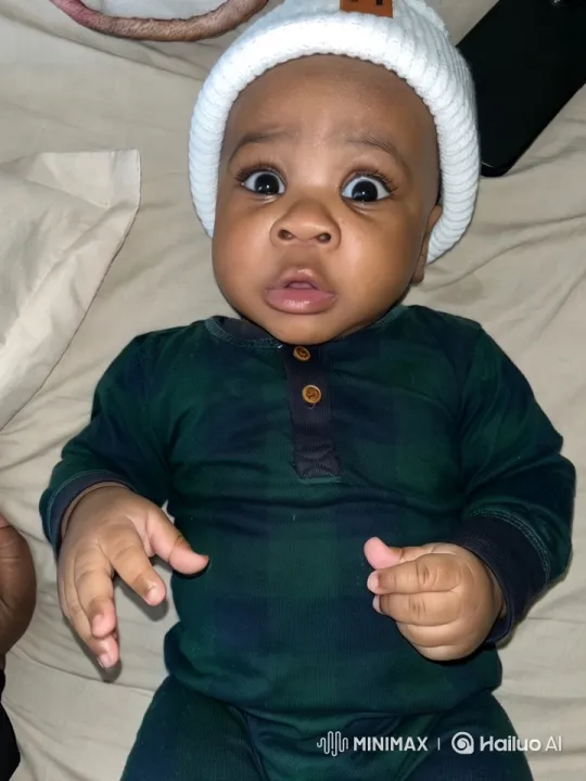 Baby's Playful Movements Captured in Cozy Setting – AI Generated Video | Hailuo AI