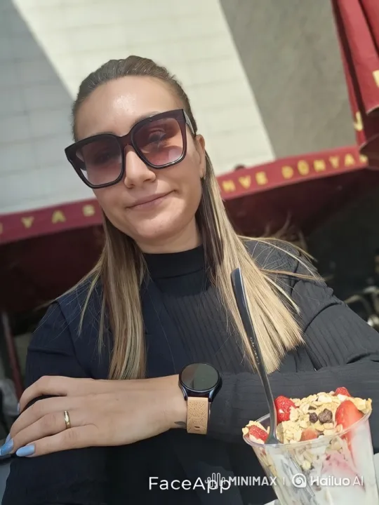 Woman Enjoying Breakfast at Modern Café with Smartwatch – AI Generated Video | Hailuo AI