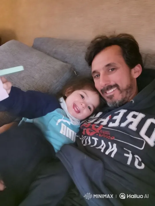 Affectionate Moment: Person and Child Cuddling – AI Generated Video | Hailuo AI