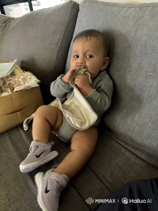 Baby Dancing with Joy on Gray Couch – AI Generated Video | Hailuo AI