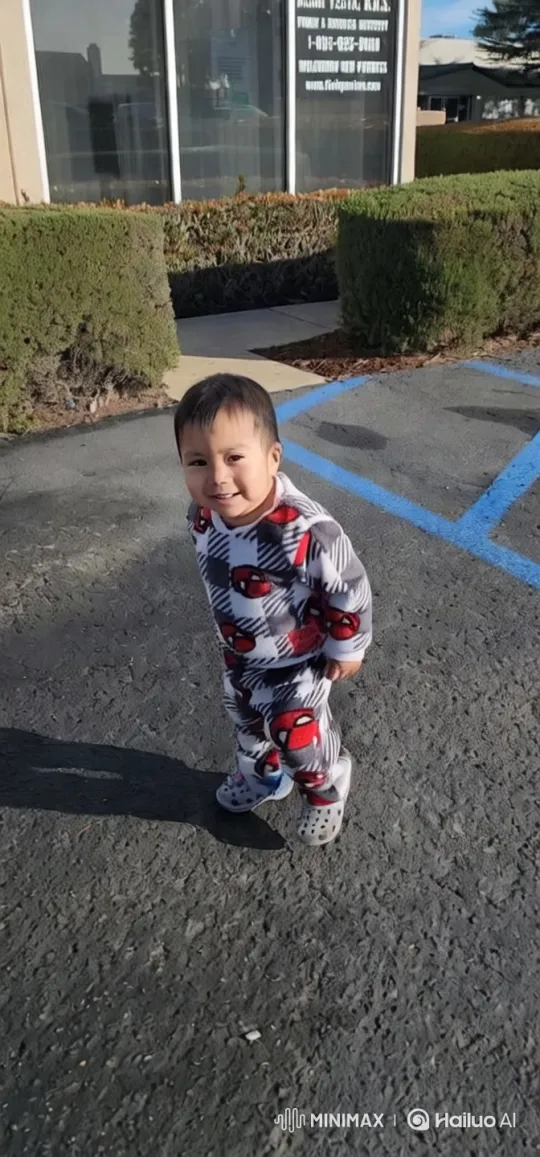 Child in Cozy Outfit Amidst Parking Lot Setting – AI Generated Video | Hailuo AI