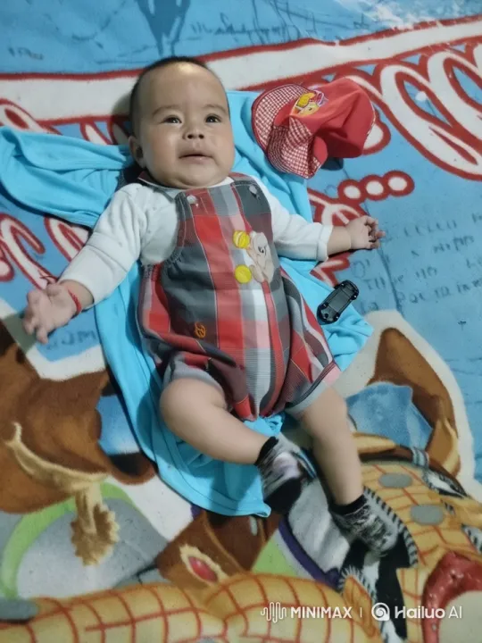 Baby's Playful Kung Fu Dance on Colorful Blanket – AI Generated Video | Hailuo AI