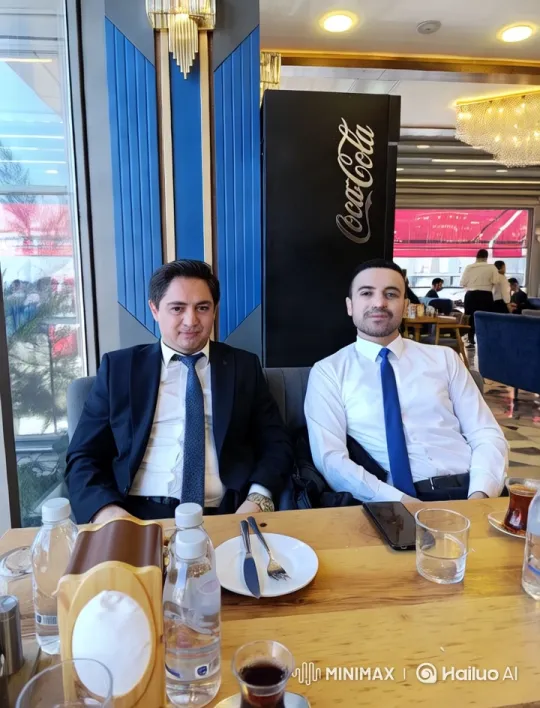 Two Men Share Laughter in Elegant Restaurant Setting – AI Generated Video | Hailuo AI