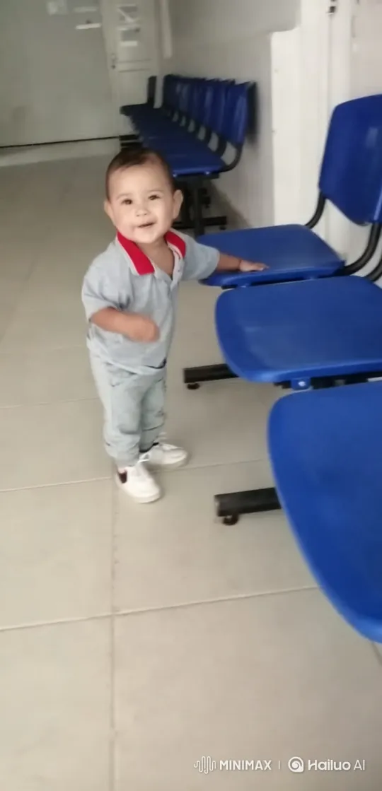 Child in Grey Outfit Explores Clean Modern Hallway – AI Generated Video | Hailuo AI