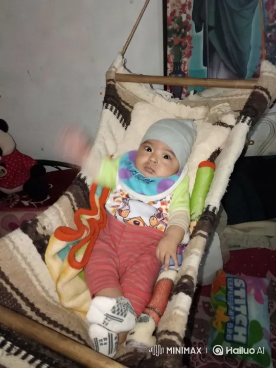 Baby Dancing Playfully in Hammock with Toys – AI Generated Video | Hailuo AI