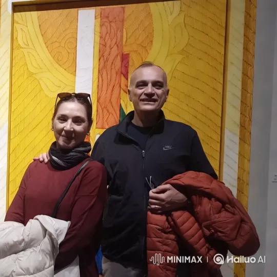Couple Embraces in Front of Colorful Artwork – AI Generated Video | Hailuo AI
