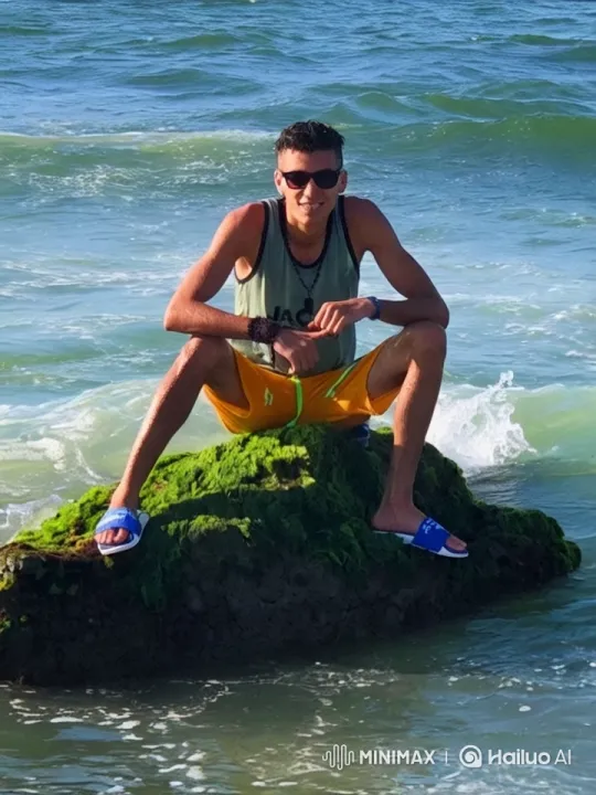 Young Man Relaxing by the Sea in Vibrant Scenery – AI Generated Video | Hailuo AI