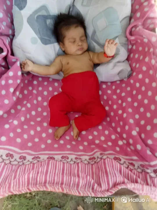 Baby on Patterned Blanket with Natural Touch – AI Generated Video | Hailuo AI