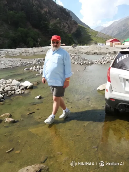 Man Walks Through Serene Mountain Landscape – AI Generated Video | Hailuo AI