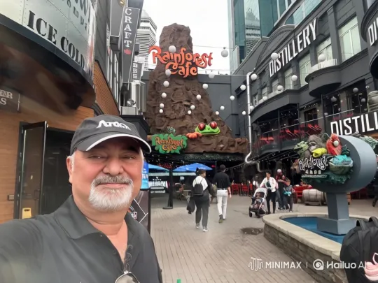 Rainforest Cafe Entrance: Vibrant Urban Scene with Animated Eyes – AI Generated Video | Hailuo AI