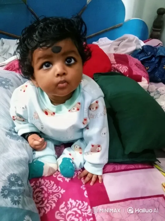 Baby on Colorful Bed with Butterflies and Rainbow – AI Generated Video | Hailuo AI