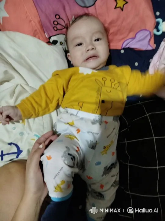 Baby's Playful Kung Fu Dance on Colorful Bed – AI Generated Video | Hailuo AI