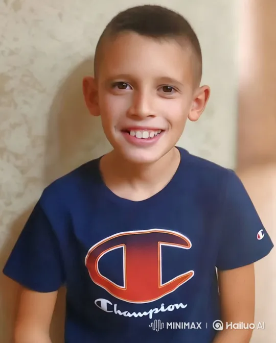 Energetic Boy in Champion Shirt Waves Cheerfully – AI Generated Video | Hailuo AI