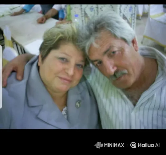 Affectionate Older Couple Embraces in Softly Lit Room – AI Generated Video | Hailuo AI