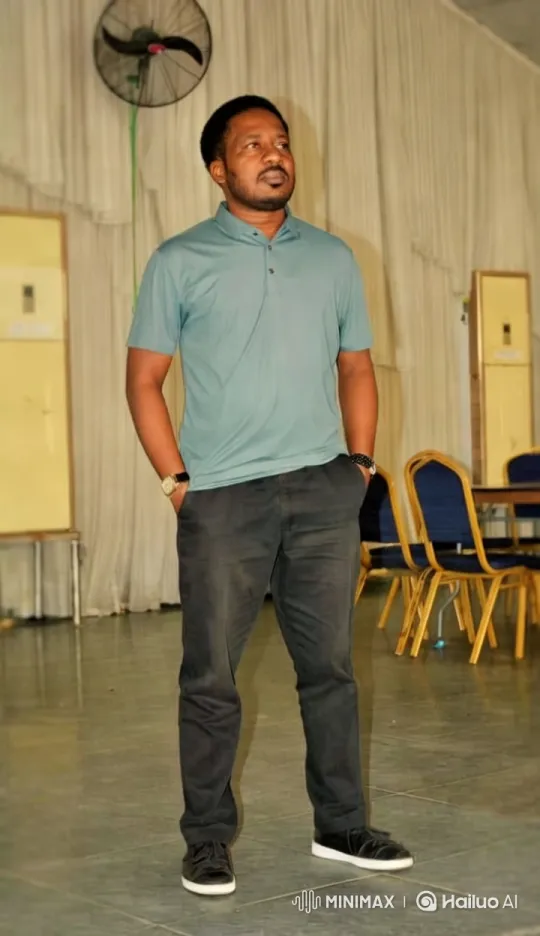 Man in Polo Shirt Stands Confidently in Dramatic Light – AI Generated Video | Hailuo AI