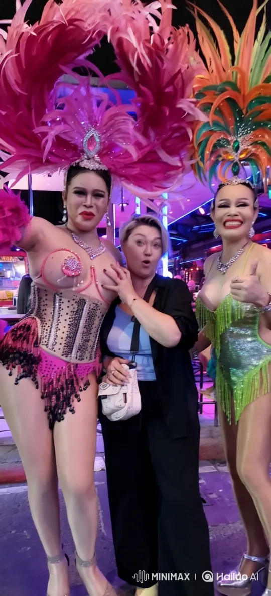 Colorful Performers Pose in Vibrant Neon Setting – AI Generated Video | Hailuo AI