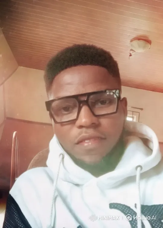 Stylish Man in Cozy Interior with Warm Aesthetic – AI Generated Video | Hailuo AI