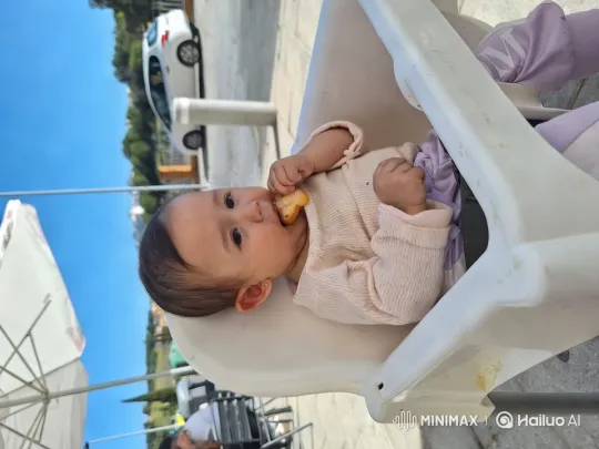 Baby in High Chair at Outdoor Café – AI Generated Video | Hailuo AI