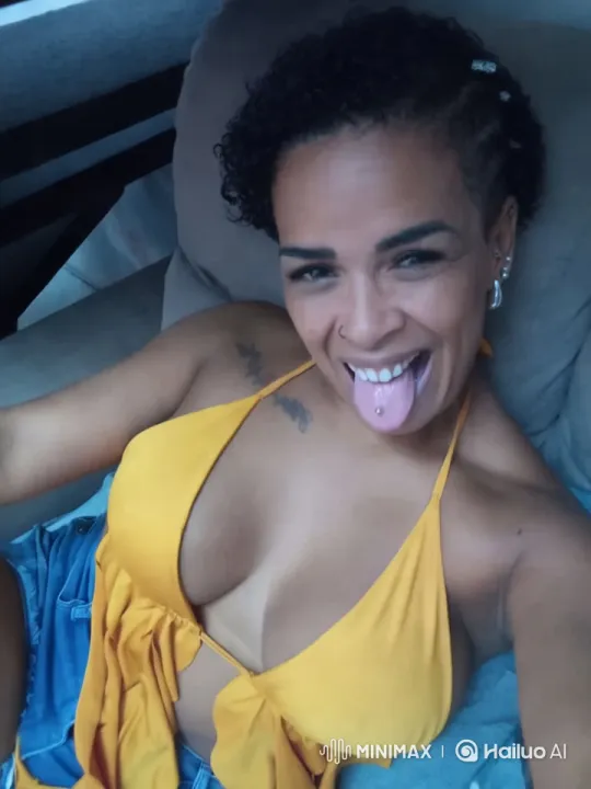 Joyful Woman with Tongue Piercing in Cozy Setting – AI Generated Video | Hailuo AI