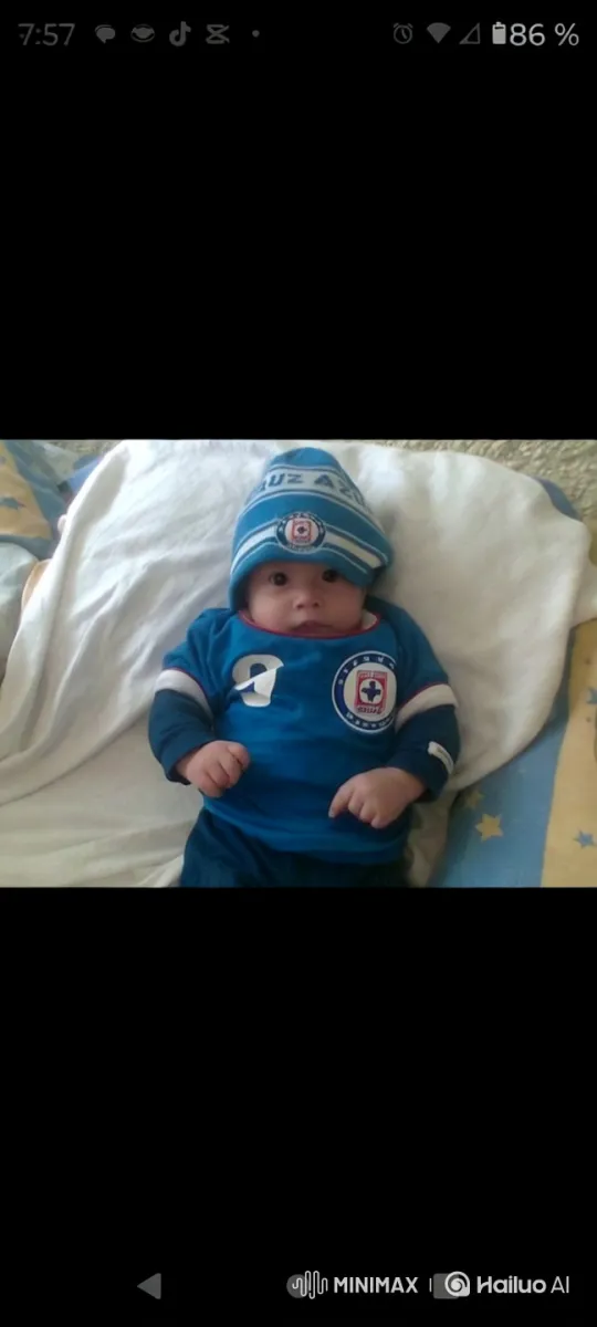 Baby in Blue Sports Outfit with Star Blanket – AI Generated Video | Hailuo AI
