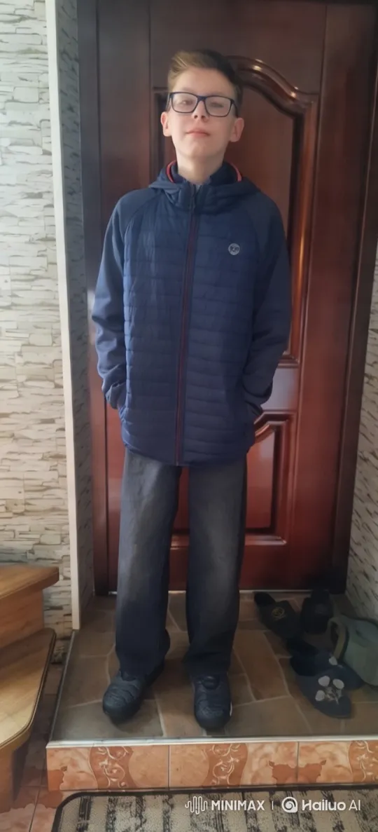 Young Boy Stands Calmly in Homely Setting – AI Generated Video | Hailuo AI
