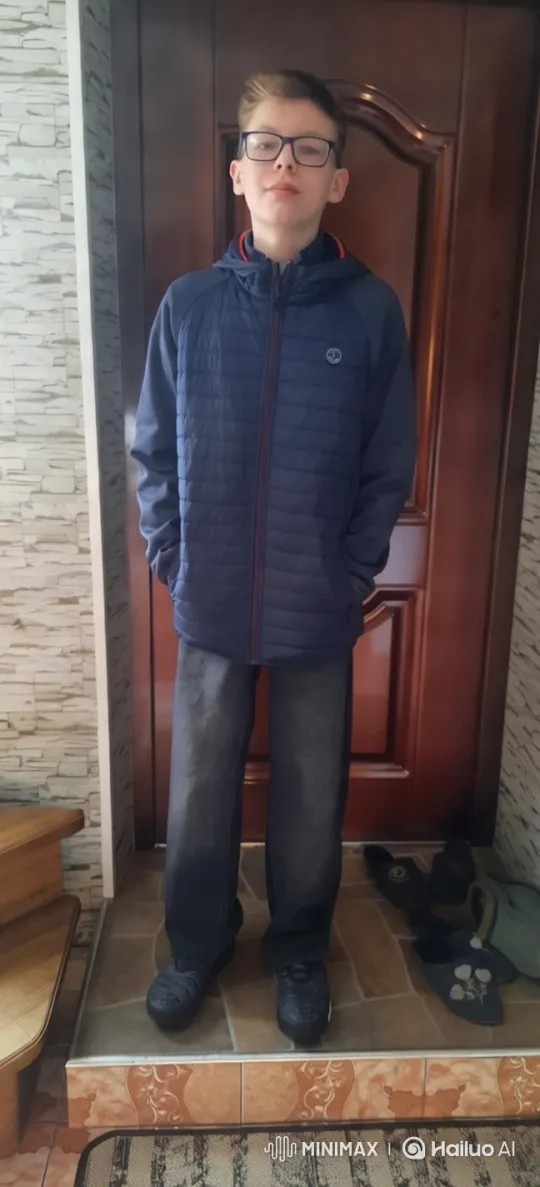 Boy in Blue Jacket on Tiled Steps with Staircase – AI Generated Video | Hailuo AI