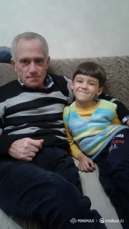 Elderly Man and Child Embrace in Cozy Living Room – AI Generated Video | Hailuo AI