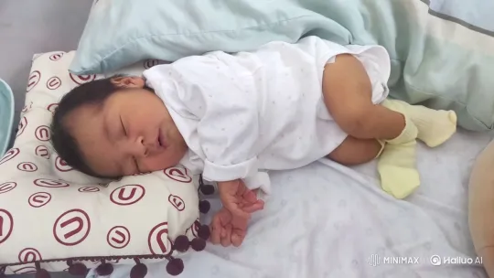 Baby Dancing Joyfully in Cozy Bedding Setting – AI Generated Video | Hailuo AI
