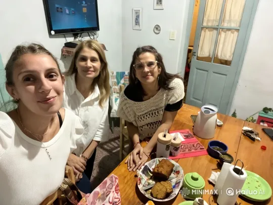 Women Enjoying a Cozy Gathering Around a Dining Table – AI Generated Video | Hailuo AI